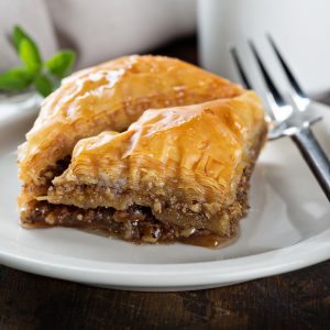 Baklava,On,A,Dessert,Plate,With,A,Cup,Of,Coffee Baklava,On,A,Dessert,Plate,With,A,Cup,Of,Coffee